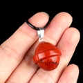 Red crystal planet pendant with ring design on black woven cord necklace - Planet Shape (1926) / Red Jasper