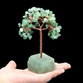 Handcrafted green crystal gemstone tree with copper wire and raw stone base - Green Aventurine
