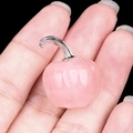 Mini pink crystal pumpkin pendant with silver metal stem shown on hand for size - Rose Quartz