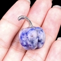 Mini natural blue sodalite stone pumpkin ornament with silver stem held in hand - Sodalite
