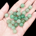 Natural green aventurine stone beads on hand showing smooth texture and size - Green Aventurine (2040)