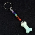 7 Chakra stone beads keychain with natural green stone bone pendant on black background - Amazonite