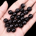 Polished black agate round beads held in hand for Hanfu clothing accessories - Black Agate (2040)