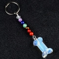 Chakra bone keychain with 7-color beads and blue opalite stone pendant on black background - Opal (Synthetic)