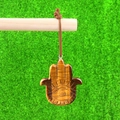 Handcrafted tiger eye stone Hamsa hand pendant with protective eye engraving and cord - Tiger's Eye