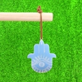 Blue opal Hamsa Hand pendant with carved eye pattern and brown leather cord - Opalite (Synthetic)