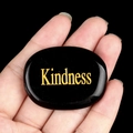 Polished black crystal palm stone with engraved golden Kindness text for mindfulness - Kindness (Obsidian)