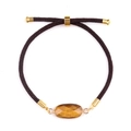Ρυθμιζόμενο καφέ πλεκτό βραχιόλι με οβάλ μάτι της τίγρης και χρυσό μεταλλικό δέσιμο - Μάτι τίγρης