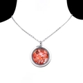 Stainless steel round locket necklace with orange crystal gravel stones on model - Red Agate