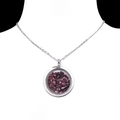 Collana con medaglione rotondo in vetro acciaio inox riempita con pietre di granato - Granato