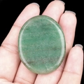 Polished natural green aventurine oval worry stone with smooth mineral texture - Green Aventurine