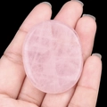 Handheld natural rose quartz oval worry stone with authentic pink crystal textures - Rose Quartz
