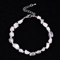 Irregular white crystal beaded bracelet with silver beads and lobster clasp closure - Blue Moonstone