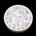 DIY white translucent agate round beads with central hole shown in a ceramic bowl - 6mm-2mm White Agate