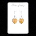 Fashionable silver framed yellow heart drop earrings for women on display card - Topaz