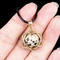 Minimalist hexagram necklace with marbled gemstone in golden frame on black cord - Dalmatian Jasper (Gold)