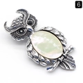 Broche hibou vintage en argent avec nacre irisée et détails en pierres noires - Coquille Blanche