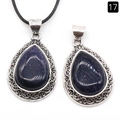 Deep blue sandstone teardrop pendant with vintage hollow metal carving and a black cord - Blue Goldstone (Synthetic)