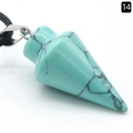 Cone shaped turquoise crystal pendant with black marble patterns on a black cord - Blue Turquoise (Synthetic)