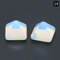 Two pyramid-shaped opal stones with iridescent sheen on a black background - Opal (Synthetic)
