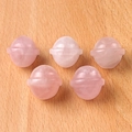 Five pink rose quartz crystal planet spheres with horizontal rings on wood surface - Rose Quartz