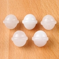 Set of five mini white quartz planet figurines with celestial rings on a wooden surface - White Crystal