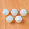 Five opal-style mini Saturn planet figurines displayed on a light wooden background - Opal (Synthetic)