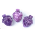 Three pieces of carved purple amethyst crystal acorn stone ornaments on white base - Lilac Stone