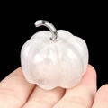 Polished white quartz pumpkin decor with silver stem held in hand for size context - Clear Quartz (1445) / 30mm