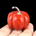 Miniature red jasper pumpkin stone carving with silver stem held in hand - Red Jasper (1445) / 30mm
