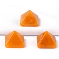 Three polished orange aventurine pyramid stones in a symmetrical arrangement - 14mm / Yellow Jade