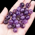 Deep purple 12mm natural stone beads with large hole design shown on a hand palm - 1 Piece / Amethyst