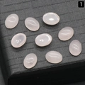 Oval pink quartz gemstone cabochons for DIY jewelry inlay on black textured grid - Rose Quartz