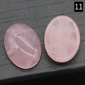 Paar ovale rozenkwarts cabochons met natuurlijke textuur op zwarte achtergrond - Rozenkwarts / 18x25mm