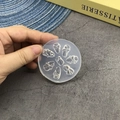 Macro detail of round translucent silicone nail art mold with 8 bow designs for DIY - 127-Bow-knot