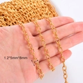 Detailed view of 1.2x5x8mm gold-plated stainless steel O-link chain for DIY jewelry - 5x8mm / Gold Cross Pattern