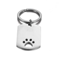 Llavero con placa de acero inoxidable pulido y un diseño calado de huella de mascota - Color Acero