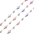 Detail of gold chain with colorful mother of pearl crosses and pastel beads - Cross