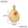 Macro detail of a 1.2cm gold stainless steel Om pendant with an orange zircon stone - Orange Zirconia Gold Oval Om Symbol Pendant (BP3281B4)