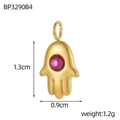 Detailed view of Hamsa Hand pendant in gold stainless steel with red zircon inlay - Purple Zirconia Gold Hamsa Hand Pendant (BP3290B4)
