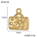 Detailed close-up of a gold rectangular pendant featuring embossed tropical palm trees and stars - Tropical Beach Tag (BP3873B)