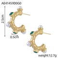 Macro view of C-shaped gold earrings with emerald green crystals and white pearls - Gold Vintage Pearl Emerald Style (AE41459D0G0)