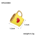 Macro view of a yellow stainless steel coffee mug charm with a red heart detail - Bright Yellow Heart Coffee Cup Style (HP2230B4)
