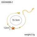 Detail of gold starfish bracelet with orange stones and small star charms on white background - Orange Rhinestone Starfish Fine Bracelet (GS03600B-2)