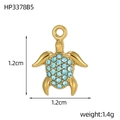 Detailed macro view of sea turtle pendant with gold plating and blue cubic zirconia stones - Gold Turtle - Light Blue Zirconia (HP3378B5)