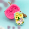 Pink silicone mold for DIY crafts featuring daisy and butterfly 3D relief shapes - Pink