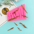 Pink silicone mold for DIY hair shapes and flowing textures with bronze resin samples - Pink