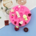 Molde de silicona rosa con formas de donut y calaveras para repostería y manualidades DIY - Rosa