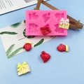 Weihnachts-Silikonform mit Handschuh-, Hut- und Geschenkbox-Motiven zum Backen und Basteln - Rosa