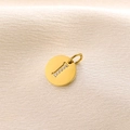 Golden round pendant featuring a letter I set with sparkling cubic zirconia stones - Letter I